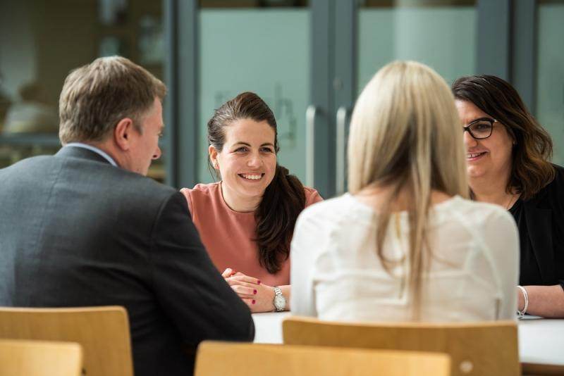 Employers discussing at a table