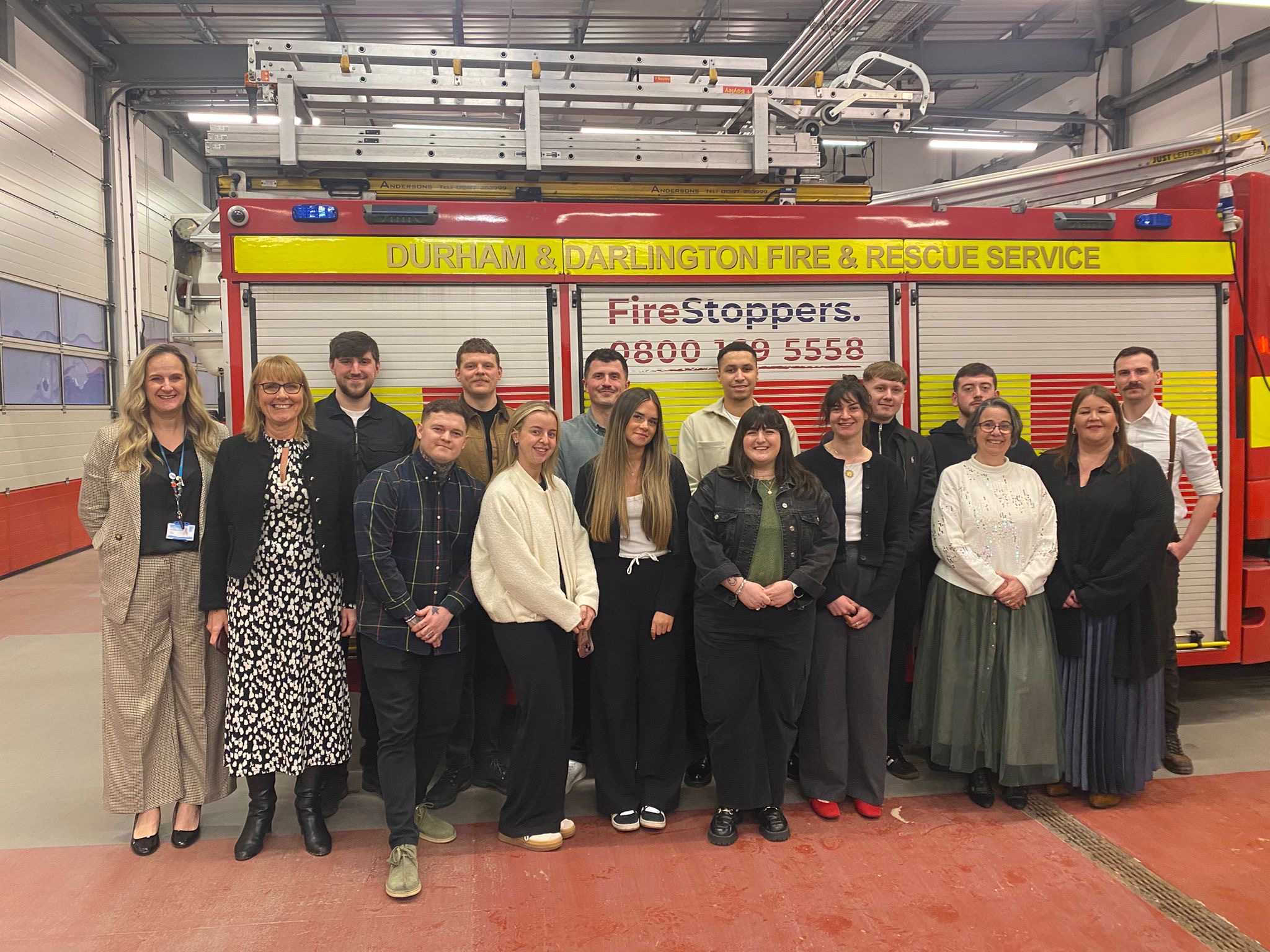  first cohort of learners to complete Fire Futures infront of fire engine with NCD staff