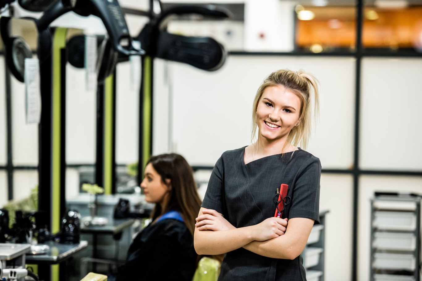 Two students hairdressing