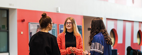 Three students talking