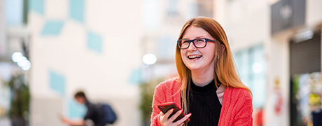 A student holding a phone