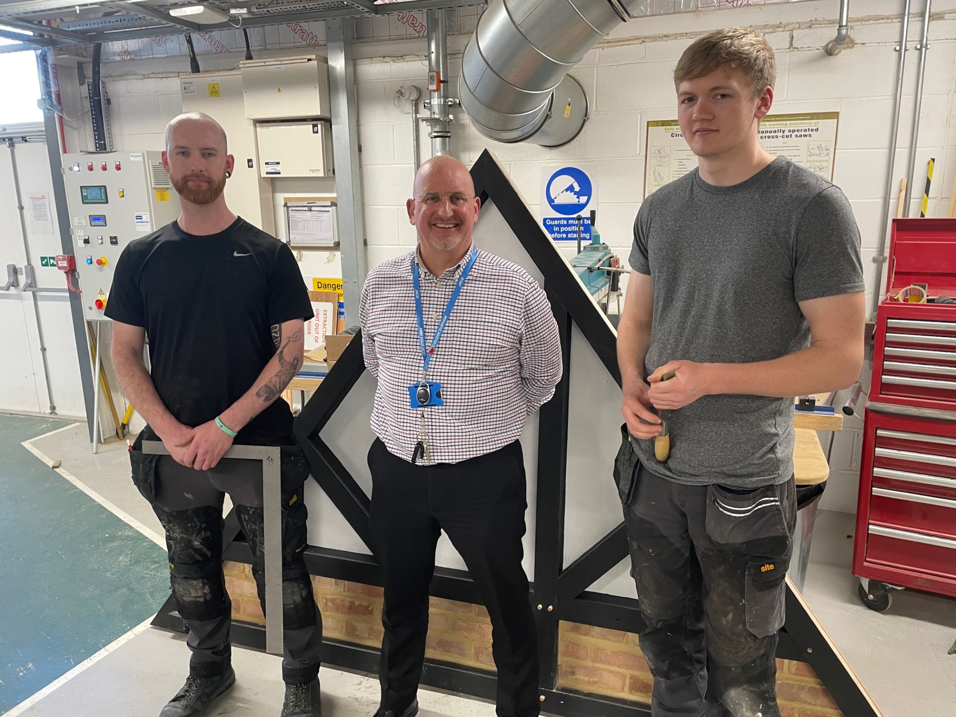 Apprentices Jay Etherington and Bradley Ingham join Simon Muschamp, Head of School – Construction, Automotive and Plumbing in celebrating their success at the recent City & Guilds Apprenticeship Showcase Challenge 