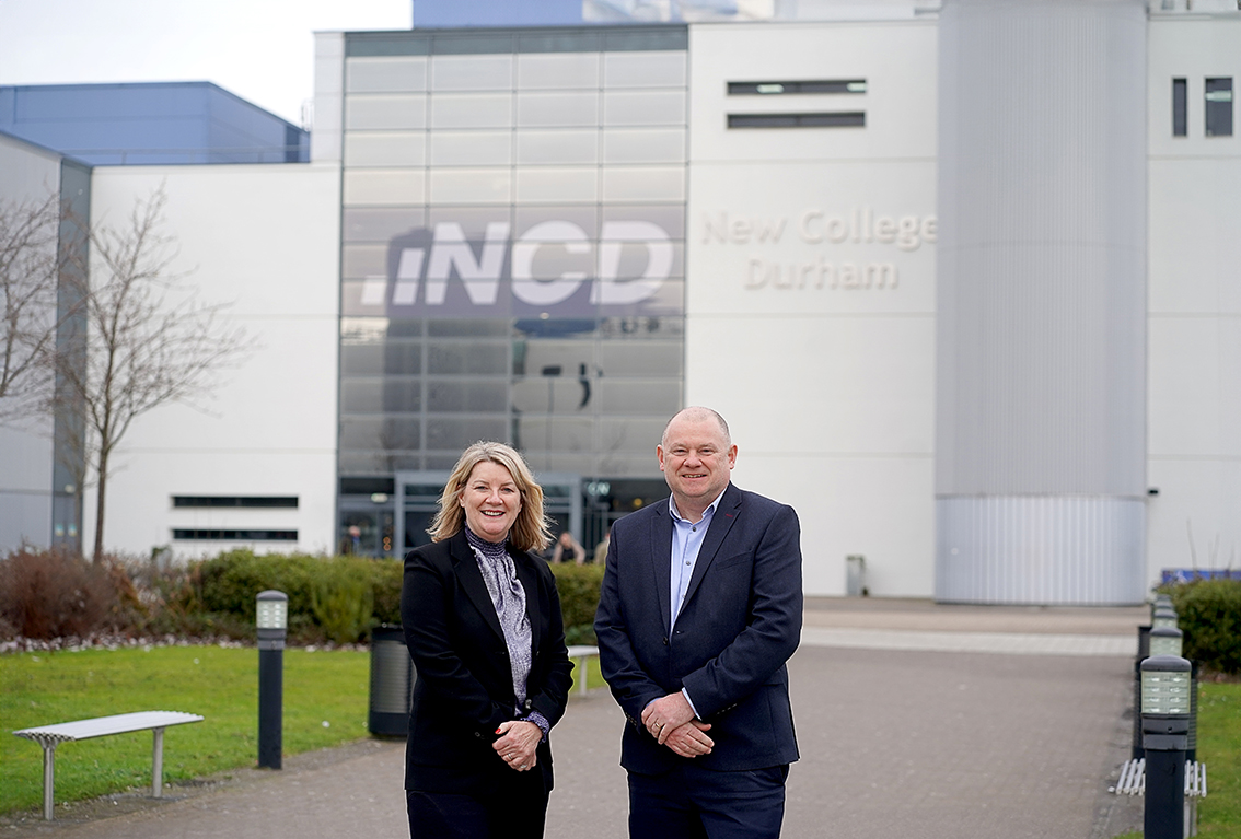 Deputy Principal, Alison Maynard, stood beside Andy Broadbent, Principal and Chief Executive, outside of New College Durham building.
