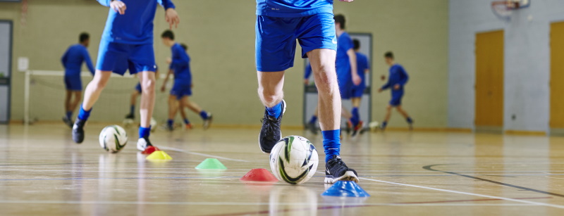 students practicing football